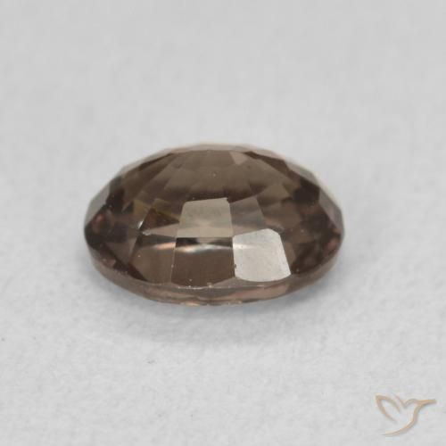 Granate que cambia de color Marrón oscuro natural de 0.97 ct, Ovalada, VS