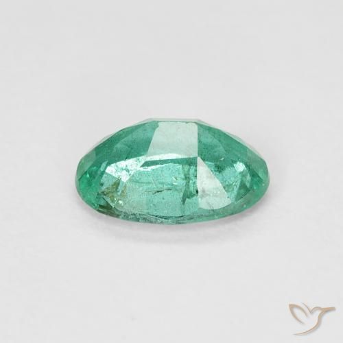 Esmeralda Verde frío natural de 0.64 ct, Ovalada, SI