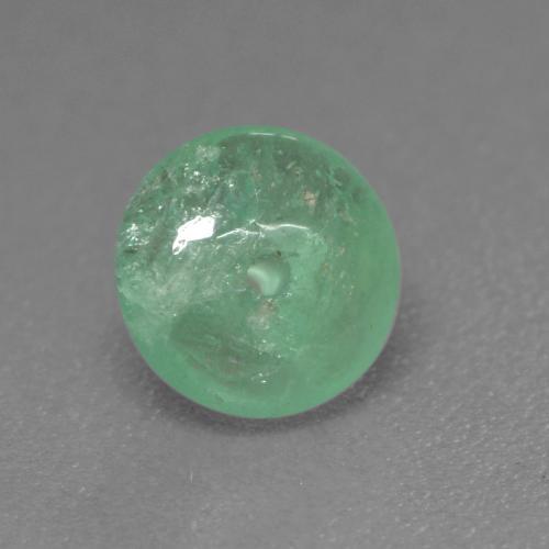 Esmeralda Verde frío claro natural de 0.79 ct, Corte Redondo, Transparente