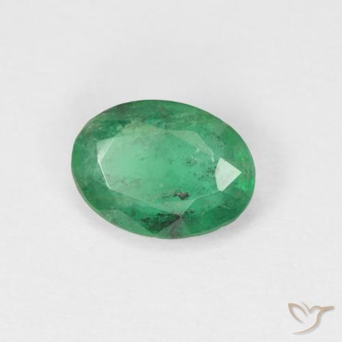 Esmeralda Verde cálido natural de 0.60 ct, Ovalada, SI