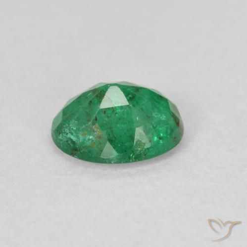 Esmeralda Verde claro medio natural de 0.60 ct, Ovalada, SI
