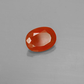 Ópalo de fuego Naranja rojizo natural de 0.89 ct, Corte Óvalo, Transparente
