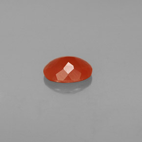 Ópalo de fuego Naranja rojizo natural de 0.89 ct, Corte Óvalo, Transparente