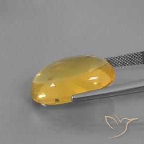Ópalo de fuego Naranja dorado natural de 15.79 ct, Ovalada, Transparente