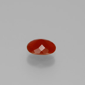 Ópalo de fuego naranja natural de 0,49 ct, corte óvalo, transparente