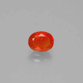 Ópalo de fuego Naranja rojizo natural de 0.62 ct, Corte Óvalo, Transparente