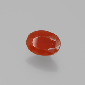 Ópalo de fuego Naranja rojizo natural de 0.54 ct, Corte Óvalo, Transparente
