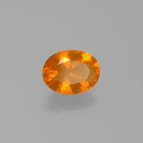 Ópalo de fuego Naranja natural de 0.77 ct, Corte Óvalo, Transparente