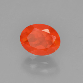 Ópalo de fuego Naranja natural de 0.71 ct, Corte Óvalo, Transparente