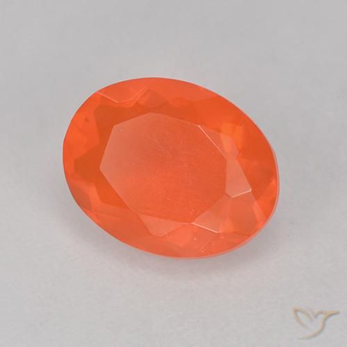 Ópalo de fuego Naranja intenso natural de 0.88 ct, Corte Óvalo, Transparente
