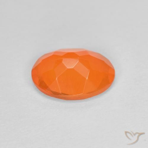 Ópalo de fuego Naranja medio natural de 0.63 ct, Ovalada, Transparente