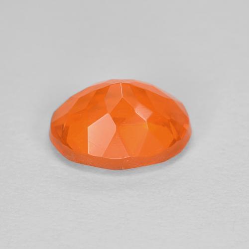 Ópalo de fuego naranja natural de 0,84 ct, corte óvalo, transparente