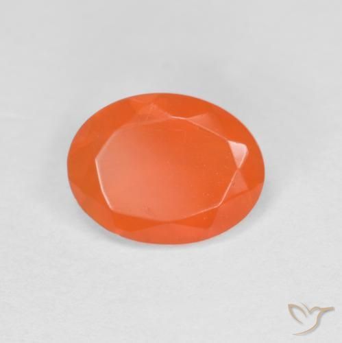 Ópalo de fuego Naranja intenso natural de 0.59 ct, Ovalada, Translúcido