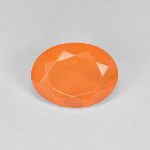 Ópalo de fuego naranja natural de 0,69 ct, corte óvalo, transparente