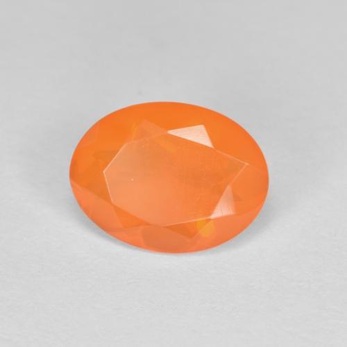 Ópalo de fuego naranja natural de 0,69 ct, corte óvalo, transparente