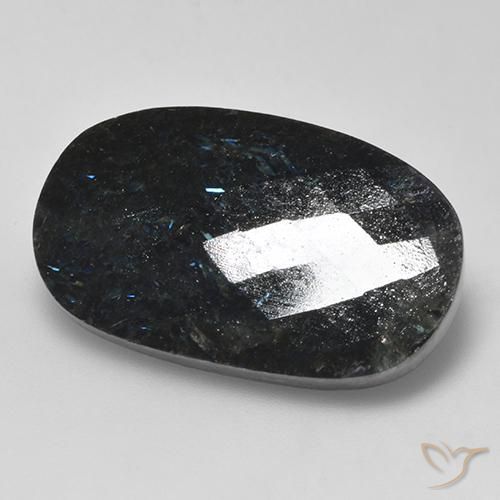 Nuummite Negro con destello azul natural de 24.26 ct, Ovalada, Opaco