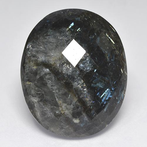 Nuummita negro con destello azul natural de 33,44 ct, corte óvalo, opaco