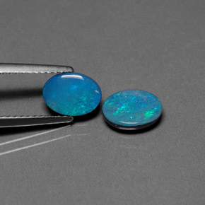 Gemas de doblete de ópalo multicolor natural de  ct, corte óvalo, opaco