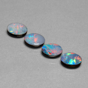 Gemas de doblete de ópalo multicolor natural de  ct, corte óvalo, opaco