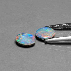 Gemas de doblete de ópalo multicolor natural de  ct, corte óvalo, opaco