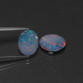 Gemas de doblete de ópalo multicolor natural de  ct, corte óvalo, opaco