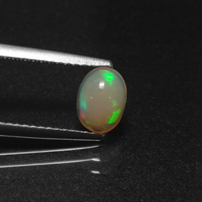 Ópalo multicolor natural de 0,58 ct, corte óvalo, translúcido