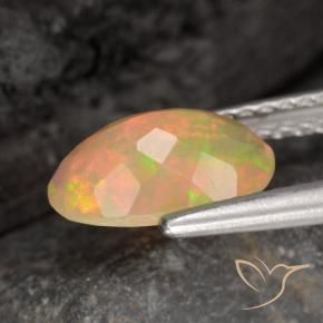 Ópalo Multicolor natural de 0.86 ct, Ovalada, Translúcido