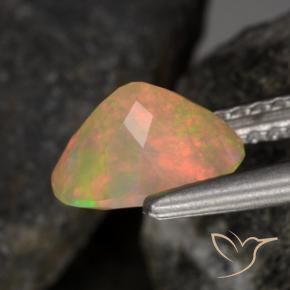 Ópalo Multicolor natural de 0.79 ct, Ovalada, Transparente