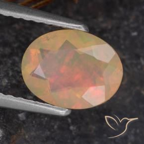 Ópalo Multicolor natural de 0.72 ct, Ovalada, Transparente