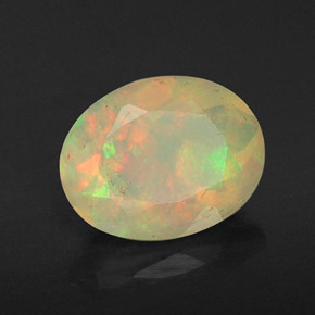 Ópalo multicolor natural de 0,80 ct, corte óvalo, transparente