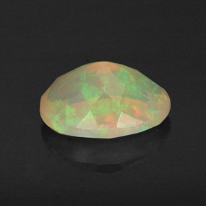 Ópalo multicolor natural de 0,80 ct, corte óvalo, transparente