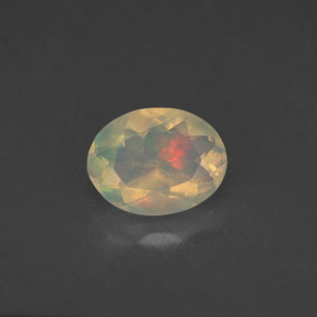 Ópalo multicolor natural de 0,77 ct, corte óvalo, transparente