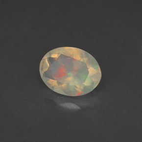 Ópalo multicolor natural de 0,77 ct, corte óvalo, transparente