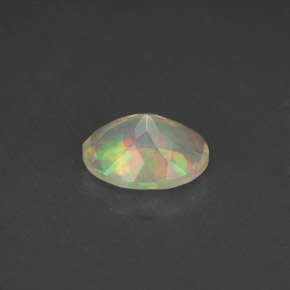 Ópalo multicolor natural de 0,77 ct, corte óvalo, transparente