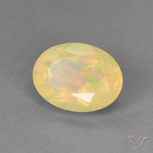 Ópalo Multicolor natural de 0.98 ct, Ovalada, Transparente