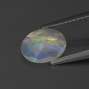 Ópalo multicolor natural de 0,83 ct, corte óvalo, transparente