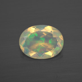 Ópalo multicolor natural de 0,86 ct, corte óvalo, transparente