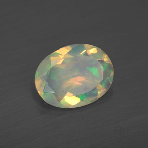 Ópalo multicolor natural de 0,86 ct, corte óvalo, transparente