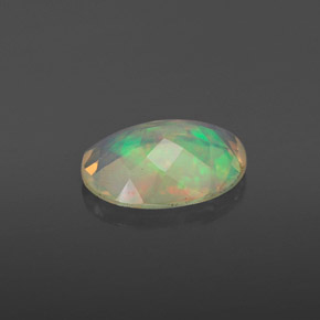 Ópalo multicolor natural de 0,86 ct, corte óvalo, transparente