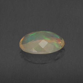 Ópalo multicolor natural de 1,34 ct, corte óvalo, transparente