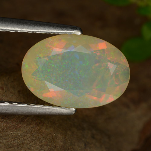 Ópalo multicolor natural de 1,26 ct, corte óvalo, transparente