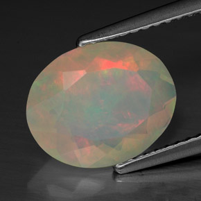 Ópalo multicolor natural de 1,74 ct, corte óvalo, transparente