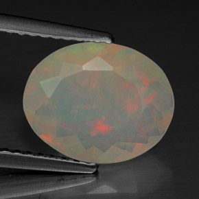 Ópalo multicolor natural de 1,74 ct, corte óvalo, transparente