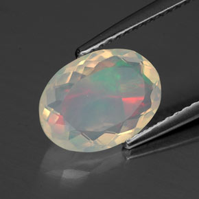Ópalo multicolor natural de 1,54 ct, corte óvalo, transparente