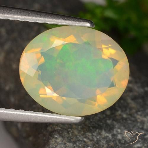 Ópalo Multicolor natural de 1.42 ct, Ovalada, Transparente