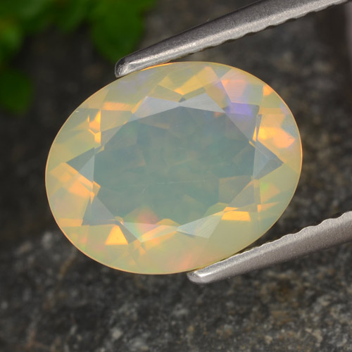 Ópalo multicolor natural de 1,29 ct, corte óvalo, transparente