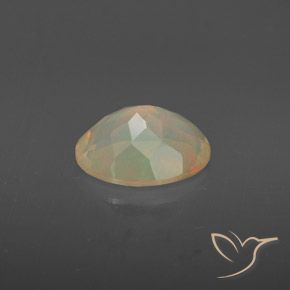 Ópalo Multicolor natural de 1.38 ct, Ovalada, Transparente