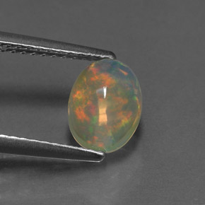 Ópalo multicolor natural de 1,11 ct, corte óvalo, transparente