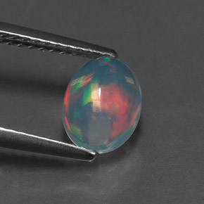 Ópalo multicolor natural de 0,89 ct, corte óvalo, transparente