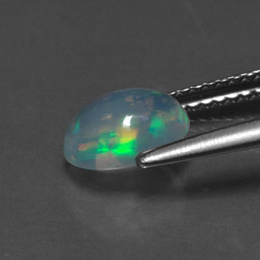 Ópalo multicolor natural de 0,89 ct, corte óvalo, transparente